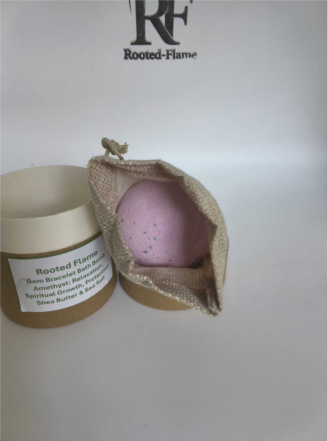 Rooted Flame Amethyst Gemstone Bracelet Bath Bomb presented in its burlap Sanctuary Vessel